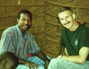 A younger Godfrey Wanamitsa and Rick Via sit in one of our medical clinics leading people to Jesus. Because of how the Lord was working in the hearts of these two men so many   ago, a beautiful friendship began and a powerful Gospel-centered partnership was formed. 